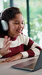 Homework, headphones and child on laptop in home for online lesson, elearning and development. Happy, student and girl wave for video call for education, studying and digital class for knowledge