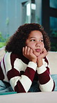 Bored, child and thinking on couch in home, moody and remember memory on break, thoughts or burnout. Lonely, kid and girl with depression on sofa, contemplating and reflection in house and daydream