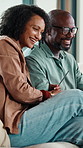 Happy couple, laugh and relax on sofa with talk, bonding and funny conversation in living room. Mature woman, African man and smile with care, love and gossip with joke, story or chat at apartment