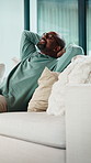Black man, relax and relief on sofa with smile, thinking and comfort with pillow in living room. Mature African person, happy and rest with perspective, break and memory with nostalgia at apartment