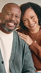 Couple, face and happy with hug in home for connection, love and relationship with care in lounge. Mature African people, embrace and smile with portrait, loyalty and pride with partner at apartment