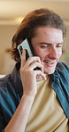 Answer, man and phone call in home, contact and communication with connection for advice. Mobile, conversation and happy person at living room for story, news or update for weekend plans with smile