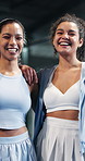 Friends, face and women with smile on tennis court, confident and laughing after sports competition. Team, bonding and happy people post workout routine, portrait or hug with athlete on fitness break