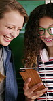 Teenager, girls and smile in high school with phone, bonding together or browsing for online gossip. Happy, students or friends by locker with tech, blog or mobile app for social media post at recess
