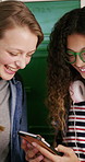 Friends, laugh and scroll in high school with phone, social media or text message with online meme. Happy, young girls or teen students by locker with tech, funny video or bonding together at recess.