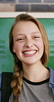Face, pride or teen in high school with laugh, knowledge or scholarship in academic development. Education, happy child or student with confidence, positive attitude or growth in learning opportunity