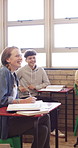 Learning, students and girl with notes in classroom for knowledge, laugh and listening to lesson. Education, teen and book in high school for course development, curriculum project or funny joke