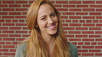 Smile, woman and face of student by brick wall for education, studying or learning with confidence. Happy, scholarship and portrait of person with pride for college about us at university in Ireland.