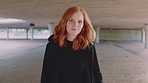 Happy girl, face and student with ginger hair in city for fashion, style or self confidence. Portrait, female person or academic learner with smile, hairstyle or hoodie for empowerment in urban town