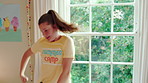 Active, child and dancing in bedroom, performance and rehearsal with smile for school play in house. Happy, kid and girls with energy for talent show, fun and practice and rhythm movement in home