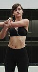 Fitness, earphones and stretching with woman in city for streaming service, health podcast and cardio. Wellness, exercise playlist and training music with person outdoor for runner, warm up and radio