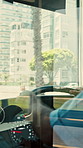 Hands, person and driving bus for journey, transit service or morning commute with vehicle dashboard. Steering wheel, public transportation and driver working, travel and man by window on trip