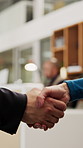 Business, collaboration or hands in agency with handshake, greeting or negotiation in b2b deal. Networking, people or employees in office with introduction, agreement or opportunity for partnership.