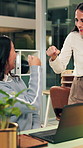 Night, laptop and business people in office with fist bump, teamwork and success for contract deal. Late, happy women and celebration in workplace with computer, collaboration or achievement of goals