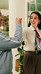 Happy, night or women in office with fist bump, sales review or good news on property development. Smile, walking or realtor team with tablet, deal closed or investment feedback in evening shift.