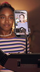 Influencer, woman and video in home with phone screen, live stream or film makeup brand deal at night. Late, black person and beauty content creator recording with tech, social media or cosmetics ad.
