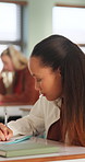 Writing, university and girl in classroom with notes for learning, studying and exam prep in lesson. School, desk and person with books for education, knowledge and answers for assignment at college