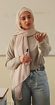 Teacher, question and Muslim woman in classroom for education, knowledge or discussion with students. School, educator and person with hijab, talk and teaching learners with smile and explanation