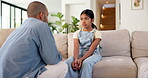 Father, child and serious discussion on sofa for bad behavior, guidance and listen to lecture. Lesson, dad and reprimand sad girl kid in home for attitude problem, teaching manners and explain rules