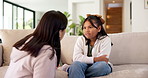 Mom, girl and sofa with discipline in home for gentle parenting, obedience or boundary. Mother, talking or speaking with child, listening or understanding for bad behaviour or guidance in house
