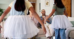 Kids, parents and clapping for ballet on sofa for dance practice, rehearsal support or bonding. Hug, family and applause to ballerina girls with tutu in home for performance praise, pride and growth