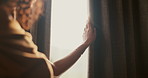 Woman, sad and hand in home with curtain, mistake or regret with reflection for decision. Person, contemplation and thinking for perspective, loss or grief with mental health in morning in house