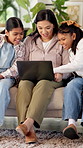 Mother, children and relax on couch with laptop, bonding or smile with movie choice in family home. Asian people, mom and girl kids with computer, streaming service or laugh for online video at house