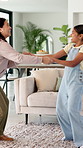 Dance, holding hands and mother with girl in living room, fun and laughing for healthy relationship. Support, happy woman or child with music for family bonding, moving together or funny spin in home