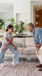 Dancing, smile and father with girl in living room, support and family bonding for healthy relationship. Holding hands, happy man and child with music for weekend fun, moving together and home