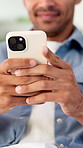 Hands, phone and relax with texting in home for contact, web chat and connection in living room. Man, typing and check notification with mobile app, scroll and post with social media at apartment