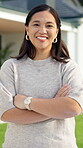 Face, woman and happy with arms crossed in front yard for new home, property ownership or growth. Homeowner, asian person and laugh outdoor for real estate investment, mortgage success or dream house