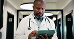 Thinking, black man and doctor with tablet in hospital with research for medical diagnosis or treatment. Digital technology, planning and mature male healthcare worker with ideas for telehealth.
