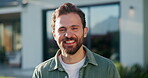 Laughing, face and man at house, outdoor and confident with property investment or mortgage approval. Happy, homeowner and person with smile for home ownership, milestone and real estate in Canada