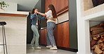 Dance, smile and mother with girl in kitchen for happy, celebration and bonding. Low angle, rhythm or music with woman and child in family home for support, weekend or holding hands for entertainment