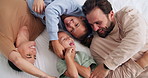 Parents, children and happy with tickle on bed, above and bonding with funny game at family house. People, kids and laugh with fun, playful and connection with love, care or laying at apartment