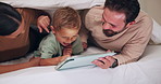 Tickle, tablet and parents with child on bed for bonding with videos, internet and connection at night. Family, home and happy mom, dad and boy on tech for playful relationship, laughing and relax