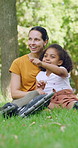 Love, mom and daughter in park with sightseeing, bonding or childcare in fitness hobby. Happy, parent or adopted child with pointing, healthy relationship or family connection in outdoor activity.