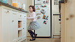Dance, smile and kid with wand in kitchen for weekend fun, childhood and motor skill development. Home, utensil and girl with playful expression of happiness, spin practice and movement for music