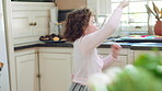 Fantasy, child or wand with spell in home for imaginative play, baking magic or creative development. Energy, girl kid or enchanted toy in kitchen for pretend wizard, magical cooking process and fun