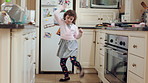 Dance, home and child in kitchen with energy, ballet or creative performance with music. Choreography, groove and girl kid moving to radio or playlist for growth and sensory development in house.