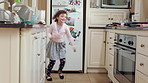 Dance, home and kid in kitchen with energy, ballet or creative performance with music. Choreography, groove and girl ballerina moving to radio or playlist for growth. talent and development in house.