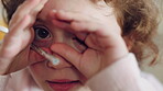 Face, hands and child with hide in home for peeking game, curious imagination and development. Wand toy, kid POV and happy with peekaboo in house for shy expression, innocent wonder and pretend play