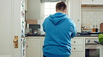 Kitchen, dance and teen with spoon, active and performance for cooking success or moving with energy. Dancer, rhythm and person with utensils, back and celebration for culinary skills in house
