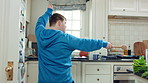 Kitchen, dance and teen with spoon, move and performance for cooking success and active with energy. Dancer, rhythm and person with down syndrome, fun and celebration for culinary skills in house