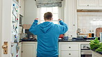 Home, dancing and man with down syndrome in kitchen, weekend celebration and moving to music rhythm. Snap fingers, spin success and person with fun for entertainment, coordination and groove to beat