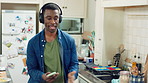 Dance, cooking and black man with headphones in kitchen with energy, audio and streaming for lunch. Happy, home and person with music for movement, rhythm and sound for meal prep, dinner or recipe