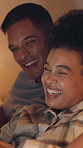 Laugh, relax and couple in home at night watching movie, series or film on weekend together. Happy, bonding and man with woman in bedroom for streaming online show with subscription in apartment.