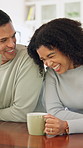 Drink, laughing and couple with coffee in kitchen for bonding, funny joke or conversation together. Man, woman and love with caffeine beverage, morning and humor or comedy with romance in home