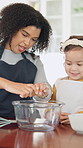 Teaching, egg and kid baking with mother in kitchen for recipe preparation in family home. Mixing, cooking education or girl learning for child development with mom, woman and dessert or treat