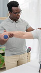 Physiotherapy, weights and senior patient with shoulder pain for mobility, wellness and healing for arthritis. Healthcare, physical therapist and person with dumbbell for help, recovery and exercise